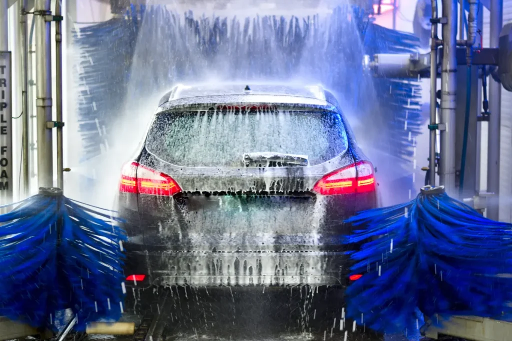 Soap dripping off a car as it goes through a carwash